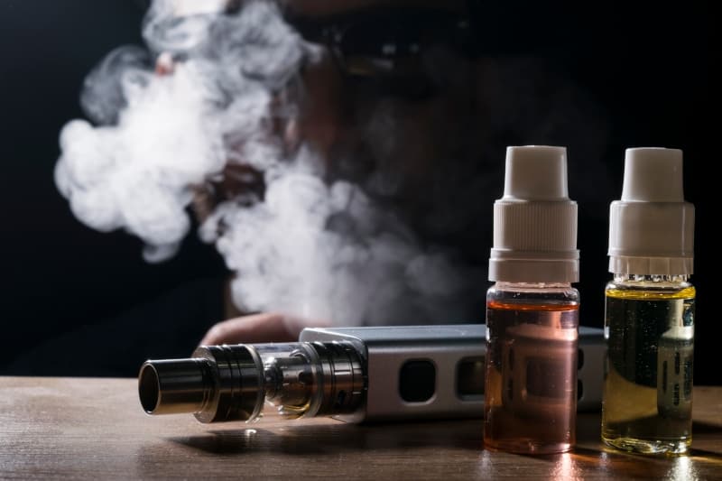 E-liquid and vaping device