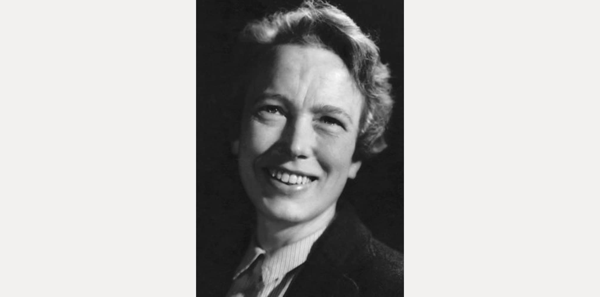 Black and white photo of a smiling Marie Neurath